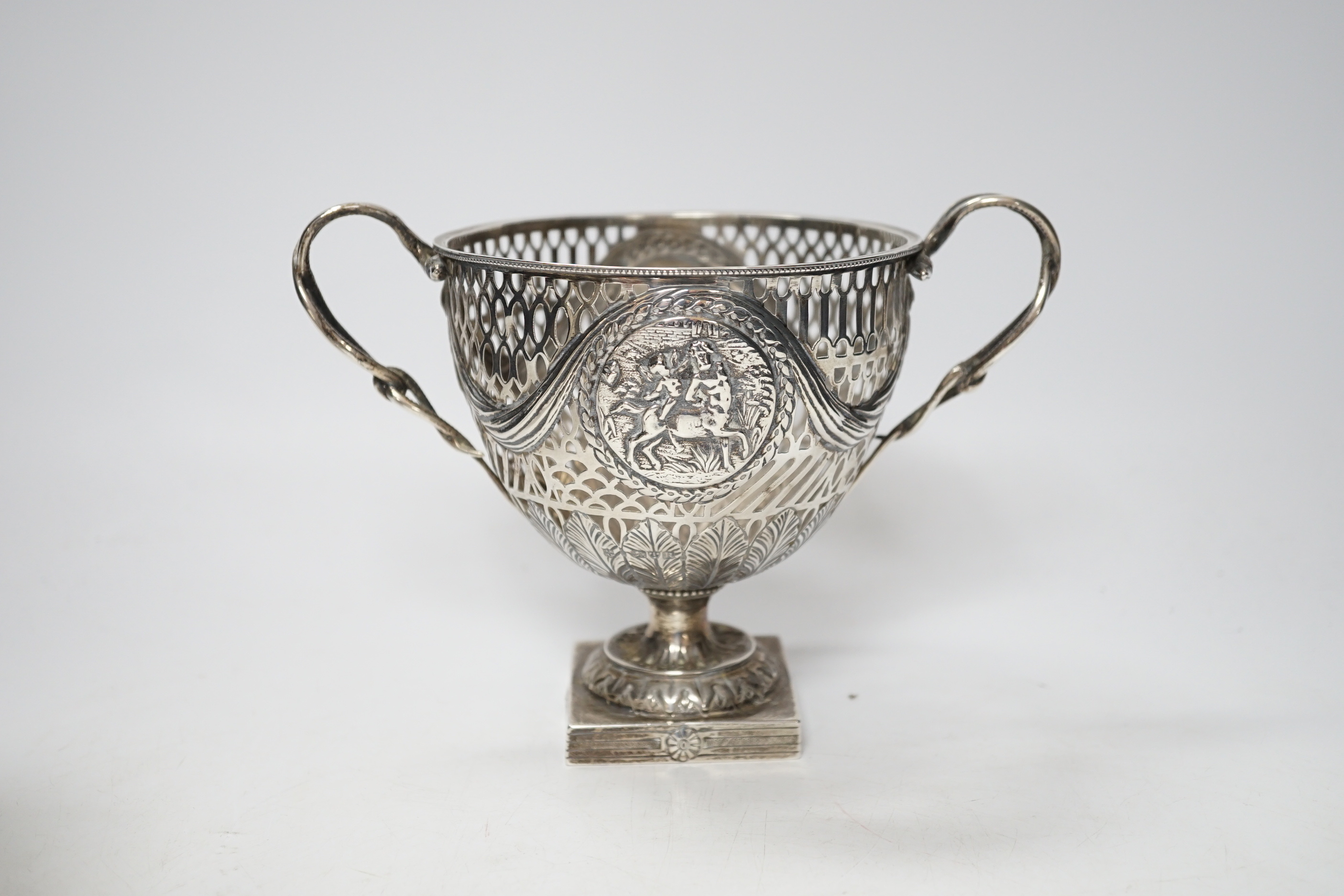 A pair of Thai circular white metal bowls, and a pair of small bowls, all decorated with animals and foliate scrolls, inscribed on bases, diameter 12cm and 8.5cm